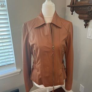Leather jacket.  Side lace up size 44.  Tan.  Bought in Paris.